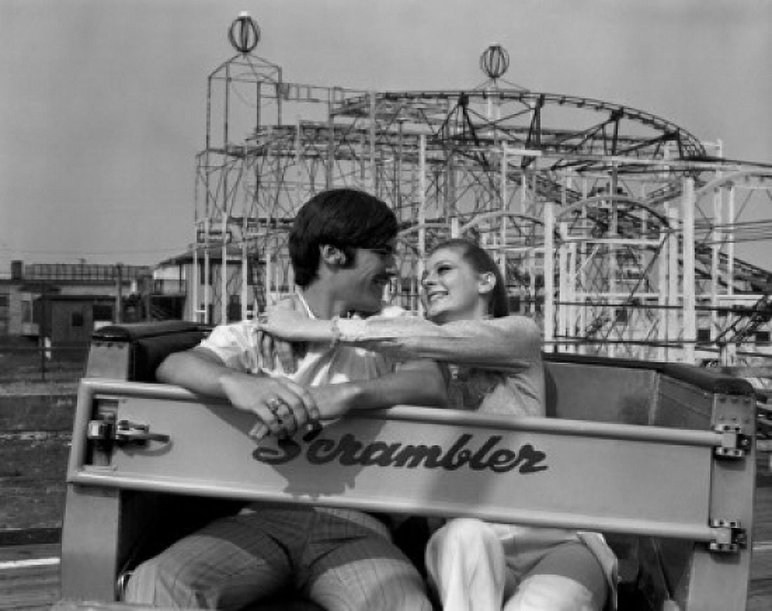 Young couple in amusement park Canvas Art - (24 x 36)