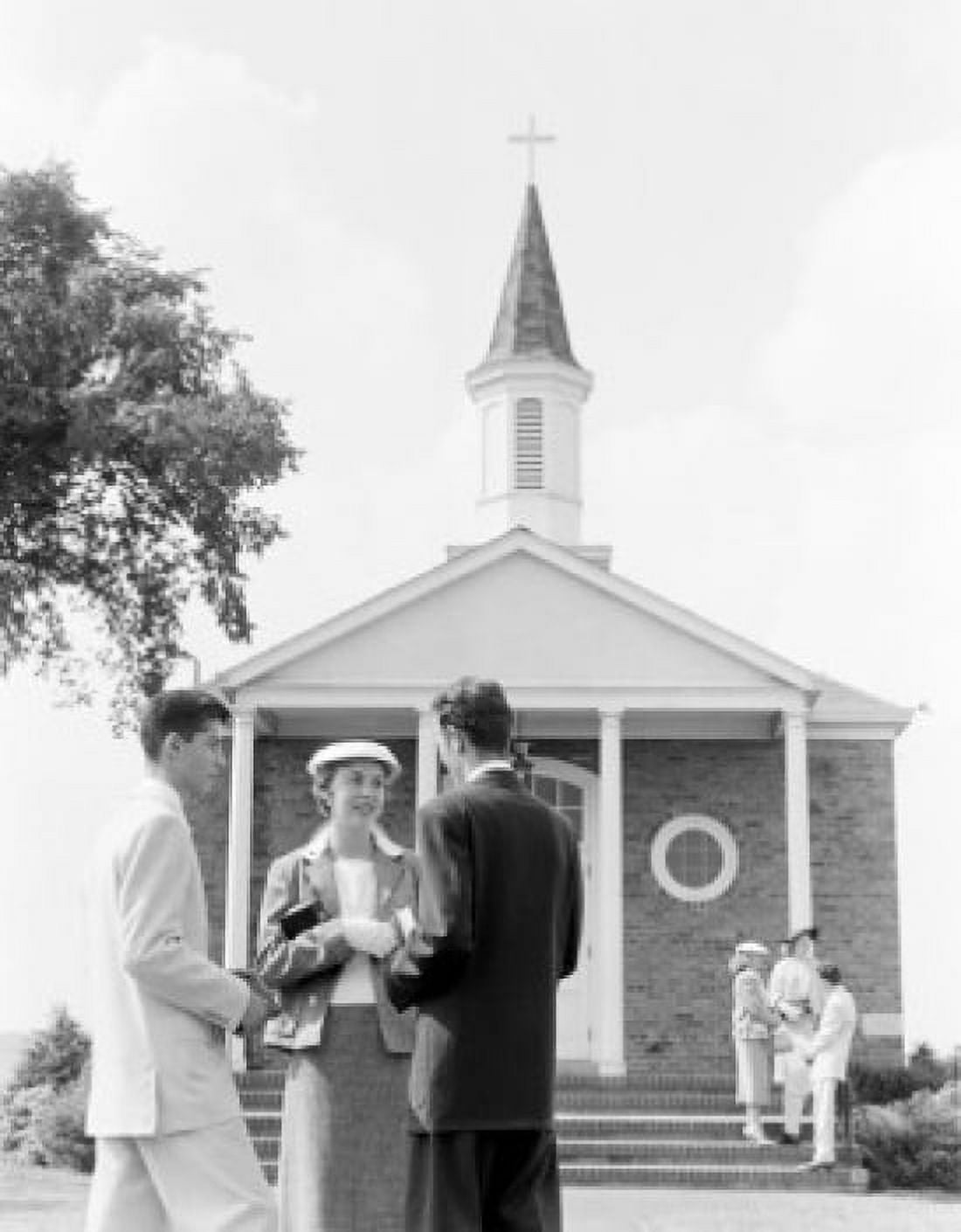 Young couple in front of church Canvas Art - (24 x 36)