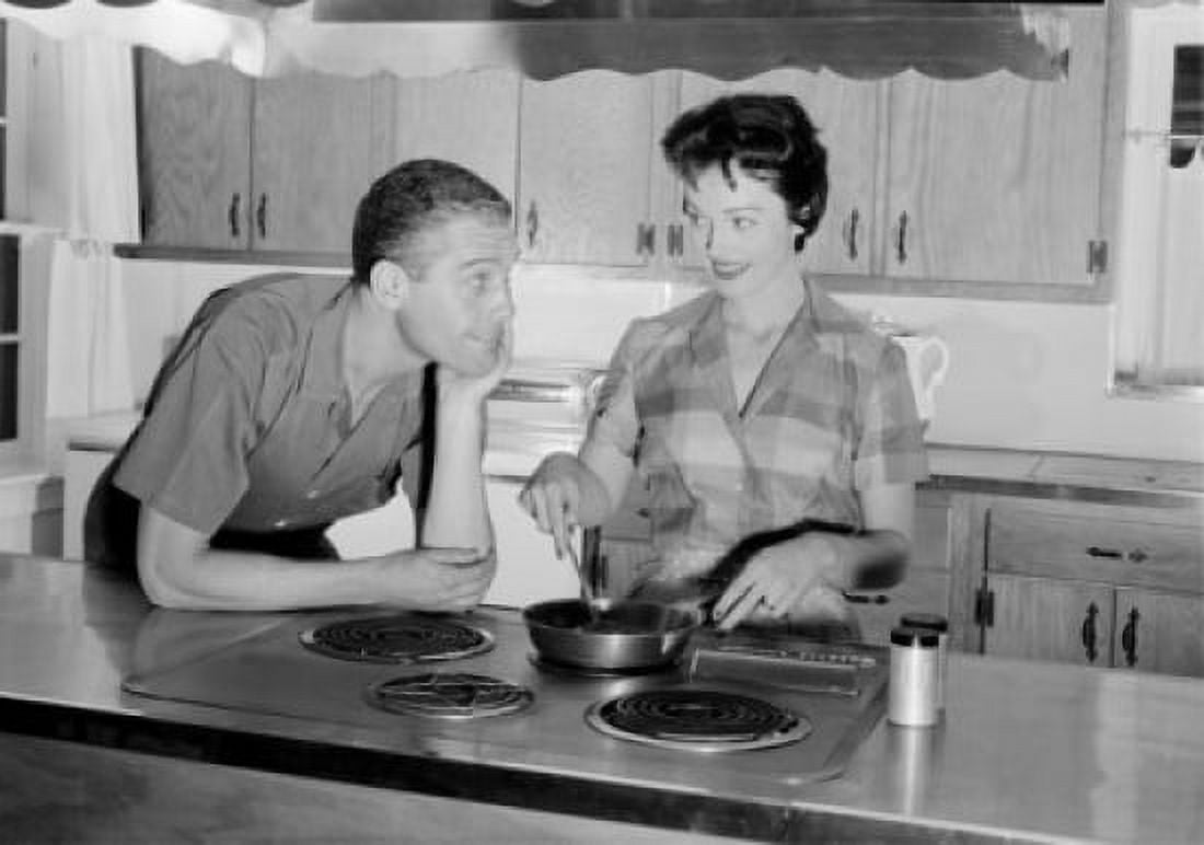 Young couple in kitchen Canvas Art - (24 x 36)