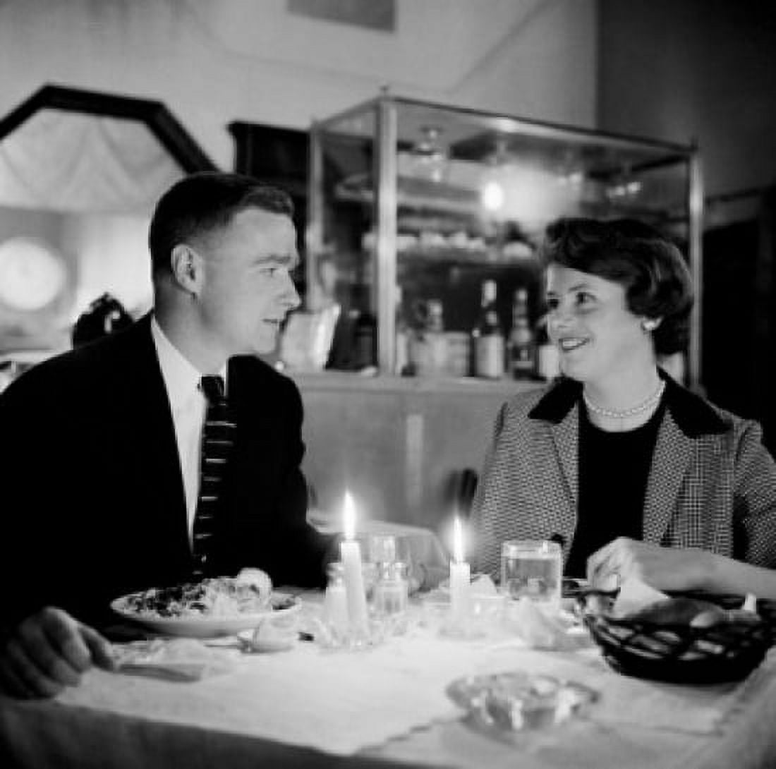 Young couple in restaurant Canvas Art - (24 x 36)