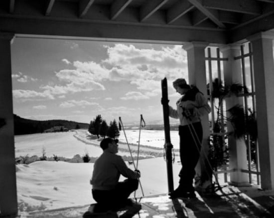 Young couple in skiwear talking Canvas Art - (18 x 24)