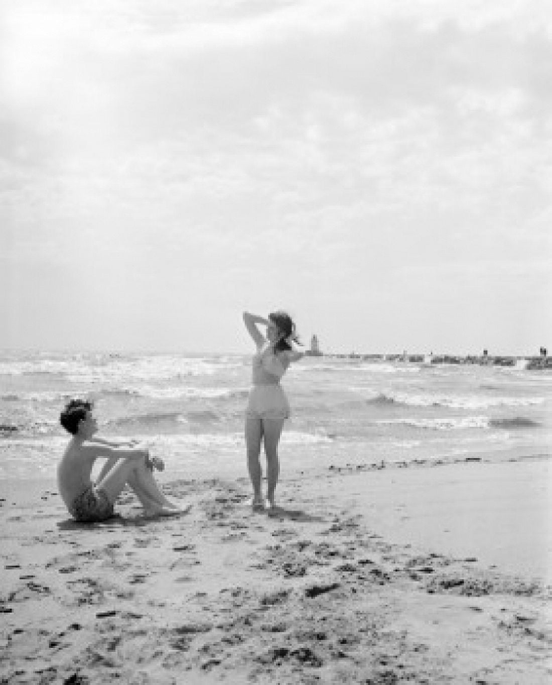 Young couple on beach Canvas Art - (24 x 36)