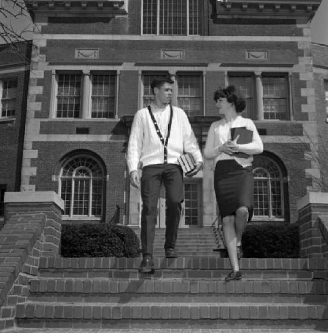 Young couple on steps outside university Canvas Art - (18 x 24)
