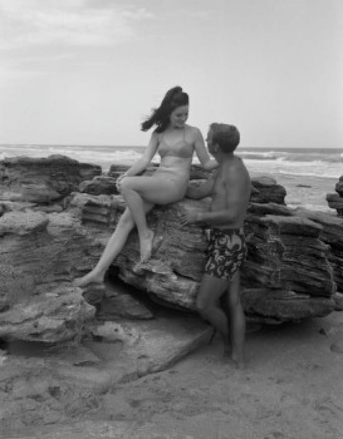 Young couple relaxing on beach Canvas Art - (24 x 36)
