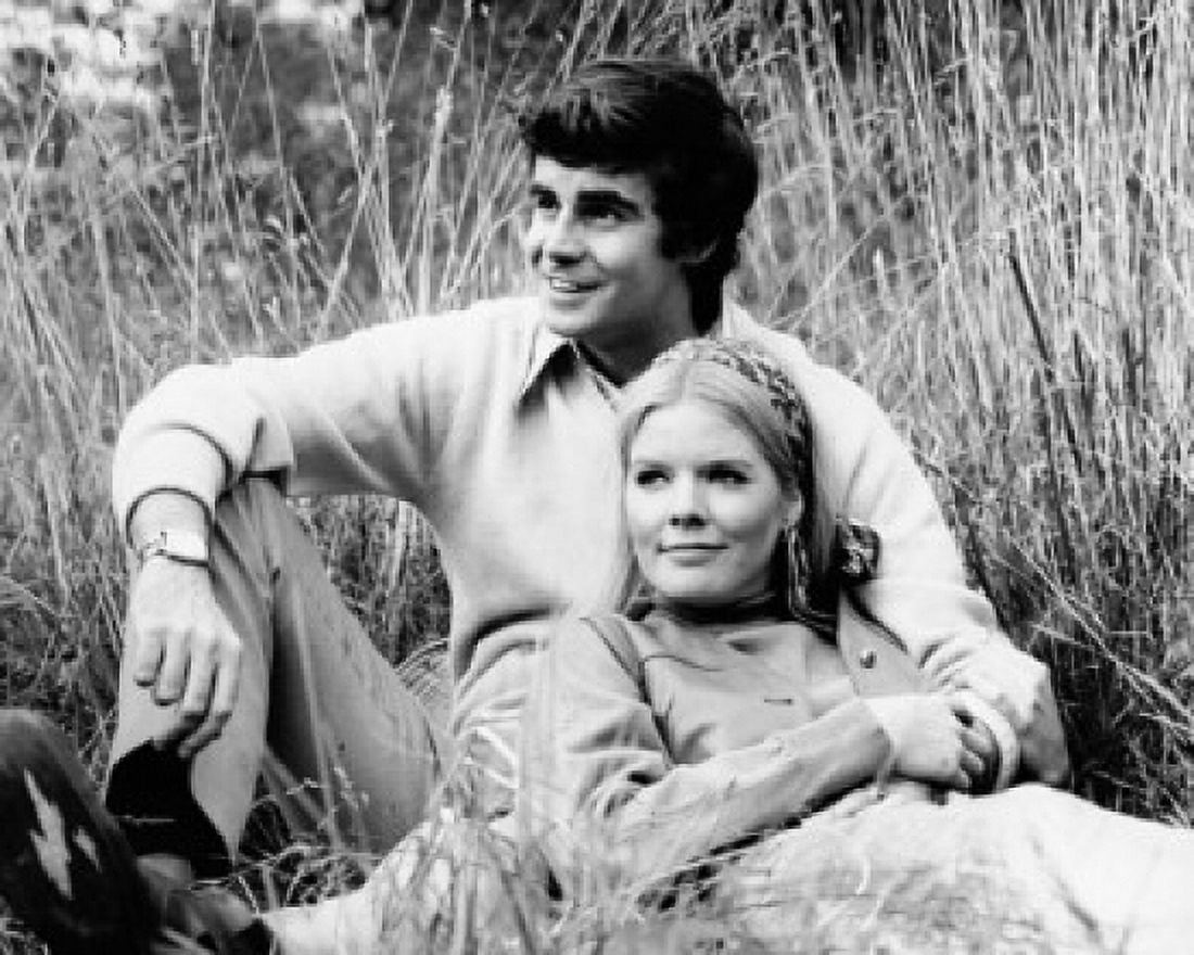 Young couple resting in a field Canvas Art - (18 x 24)