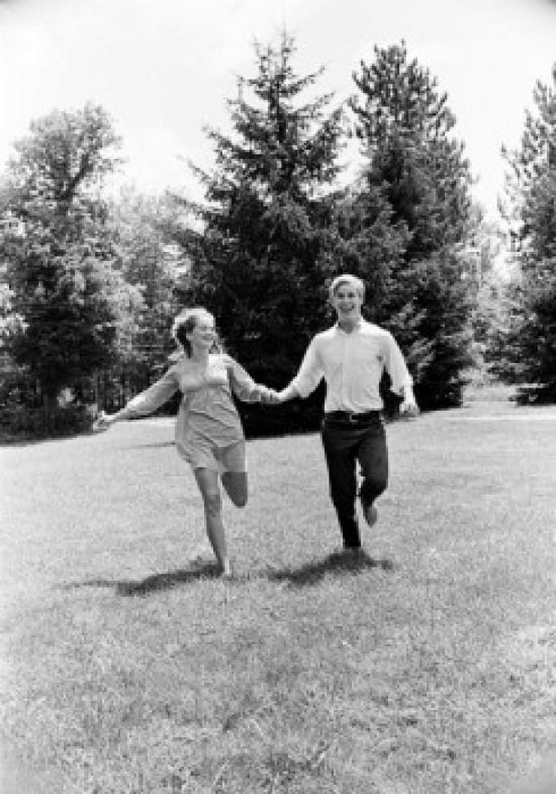 Young couple running in forest Canvas Art -  (24 x 36)