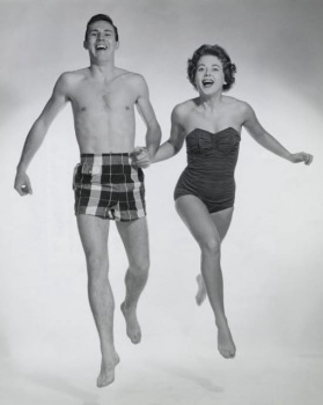Young couple running together holding hands Canvas Art - (18 x 24)
