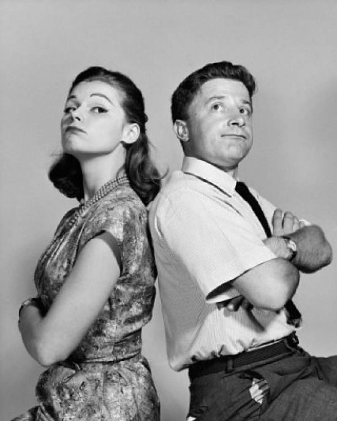 Young couple sitting back to back with their arms crossed Canvas Art - (18 x 24)
