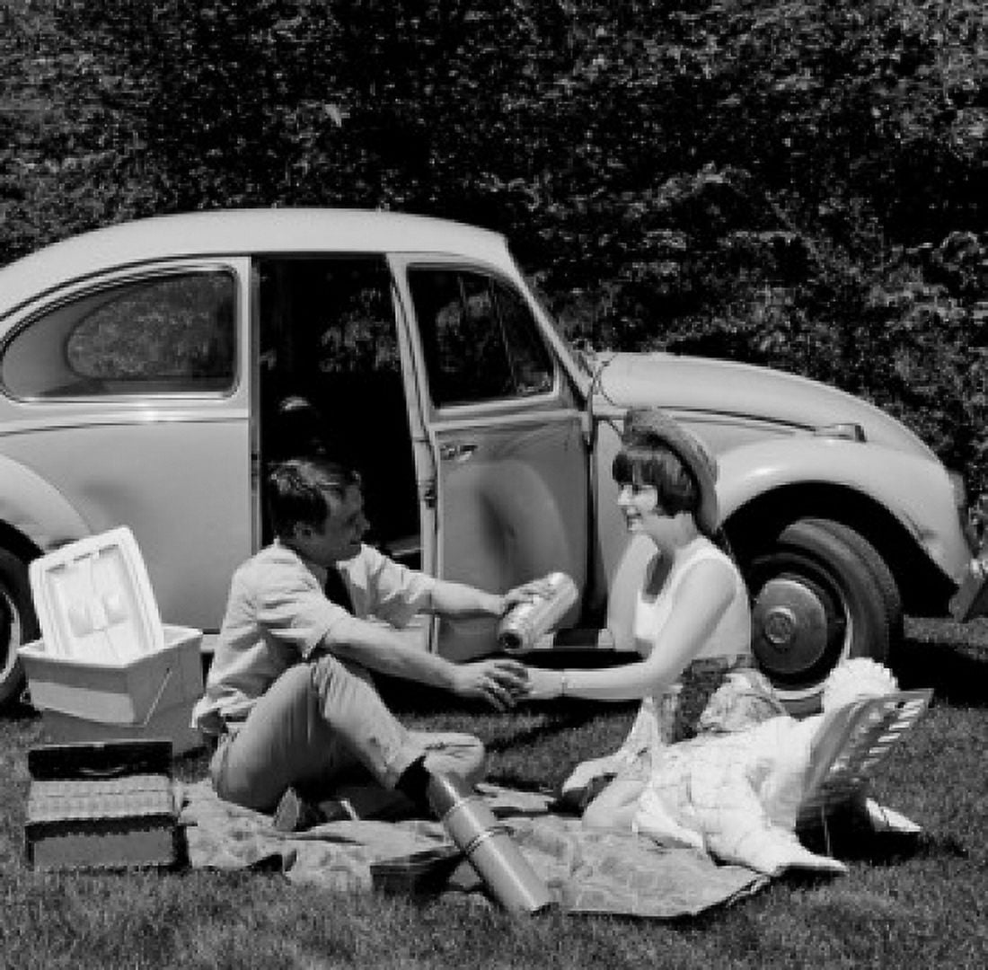 Young couple sitting by car in park having picnic Canvas Art - (24 x 36)