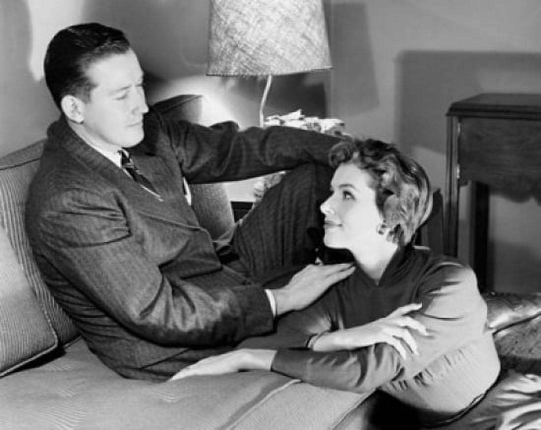 Young couple sitting in a living room Canvas Art - (18 x 24)