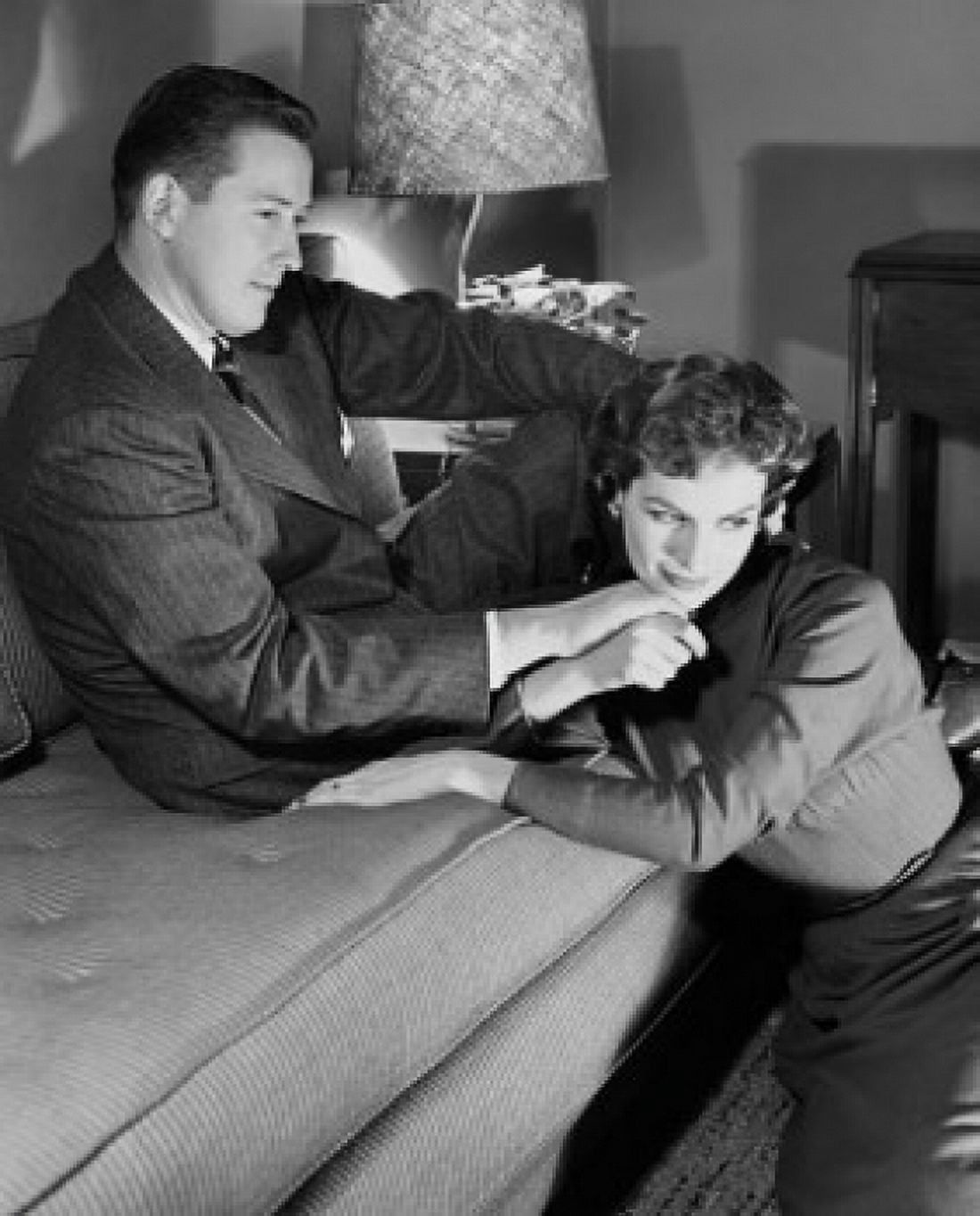 Young couple sitting in a living room Canvas Art - (24 x 36)