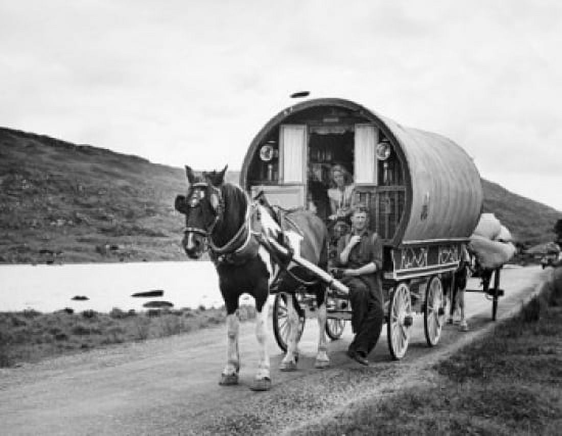 Young couple sitting on a covered wagon Killarney Ireland Canvas Art - (18 x 24)