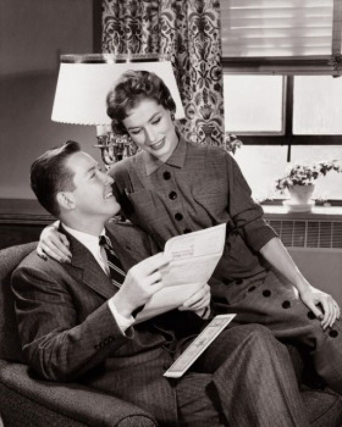 Young couple sitting together in a living room Canvas Art - (18 x 24)