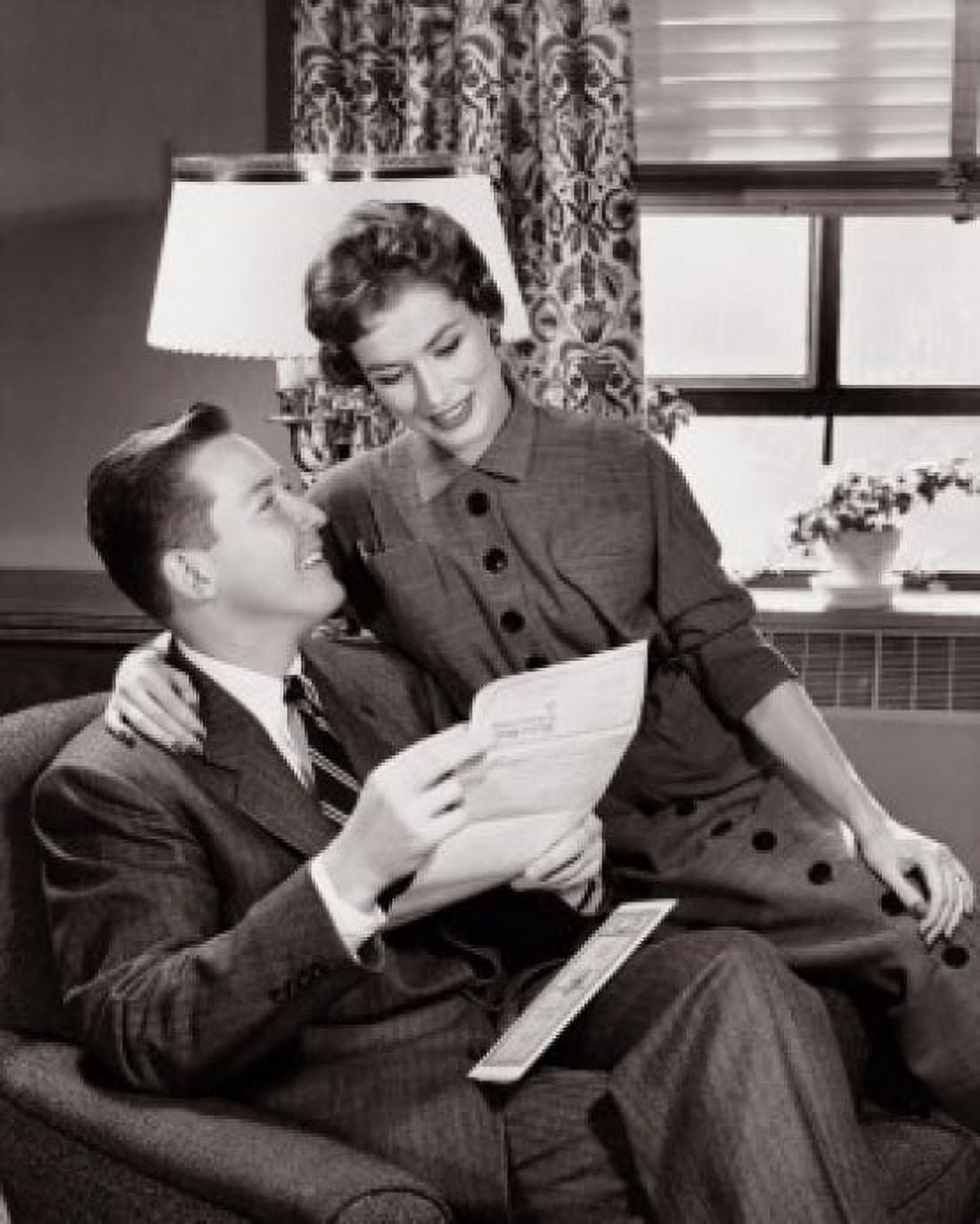 Young couple sitting together in a living room Canvas Art -  (24 x 36)