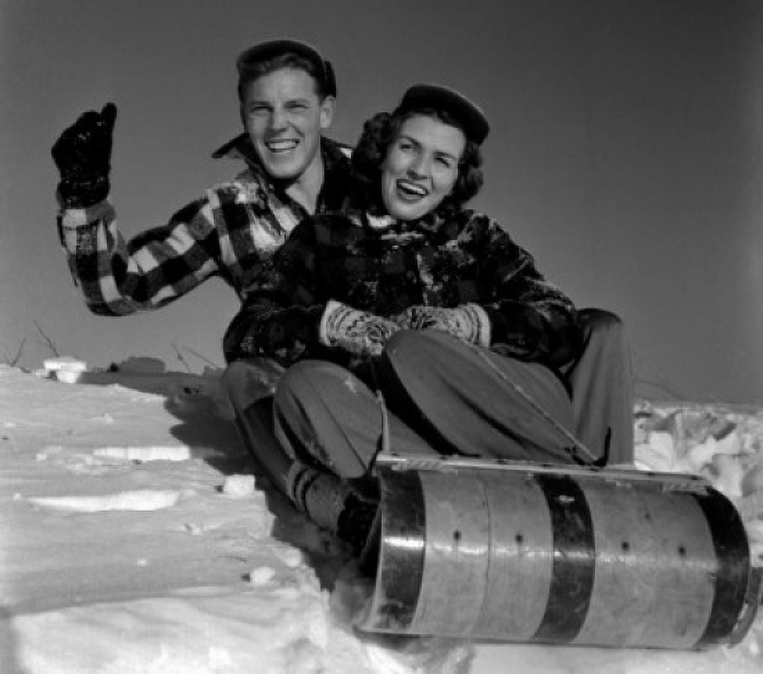 Young couple sleighing Canvas Art - (18 x 24)