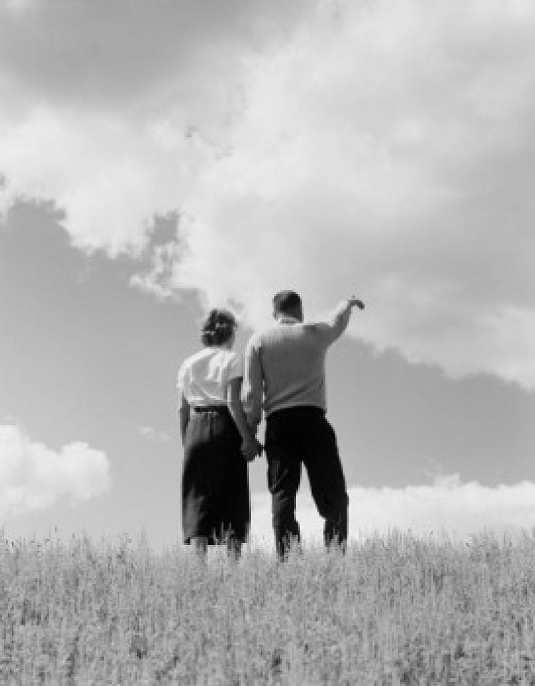 Young couple standing and holding hands rear view Canvas Art - (18 x 24)