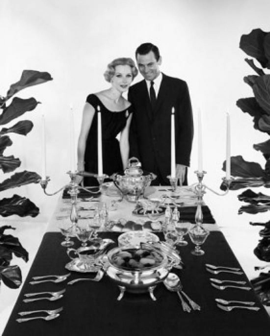 Young couple standing at a dining table Canvas Art - (18 x 24)