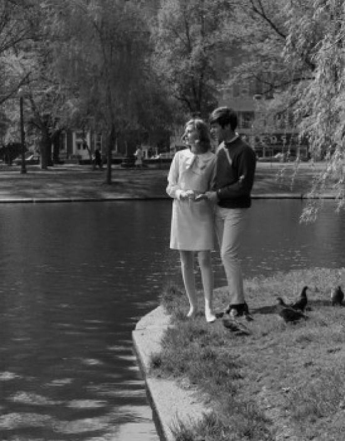 Young couple standing by lake Canvas Art - (18 x 24)