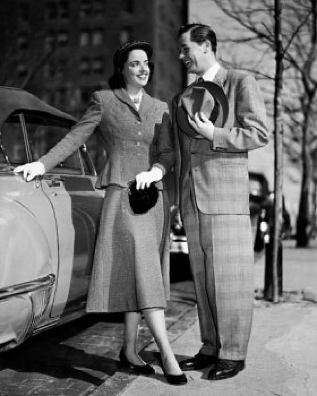 Young couple standing near a car Canvas Art - (18 x 24)
