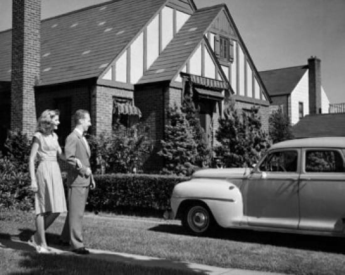 Young couple standing near a car Canvas Art - (18 x 24)
