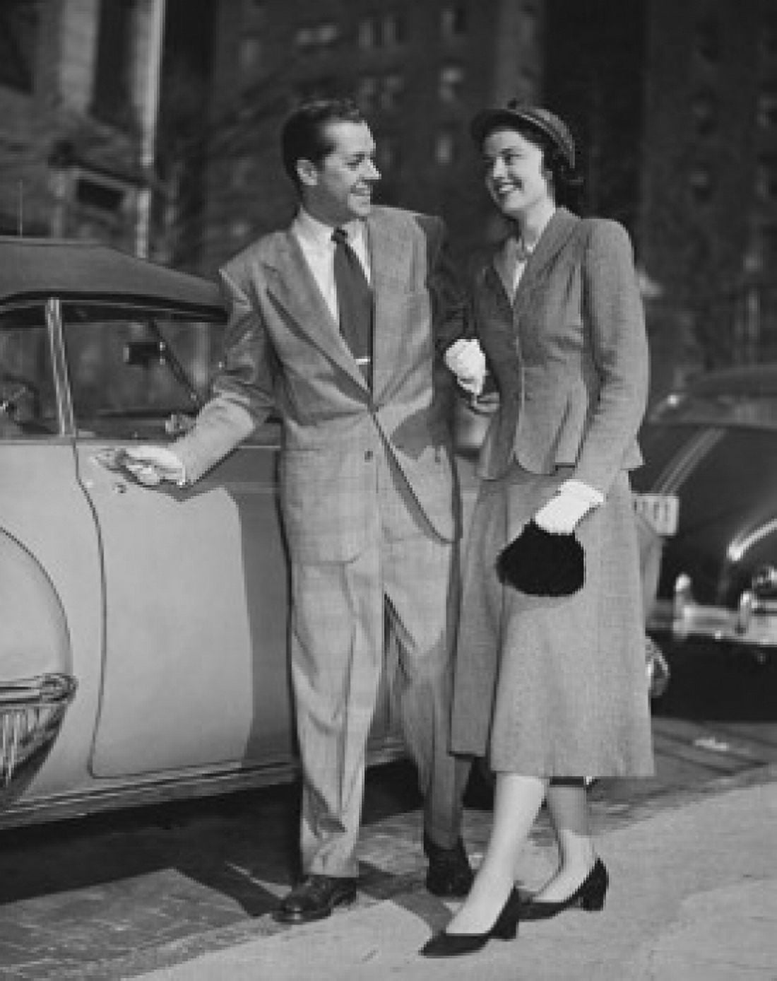 Young couple standing near car Canvas Art - (18 x 24)