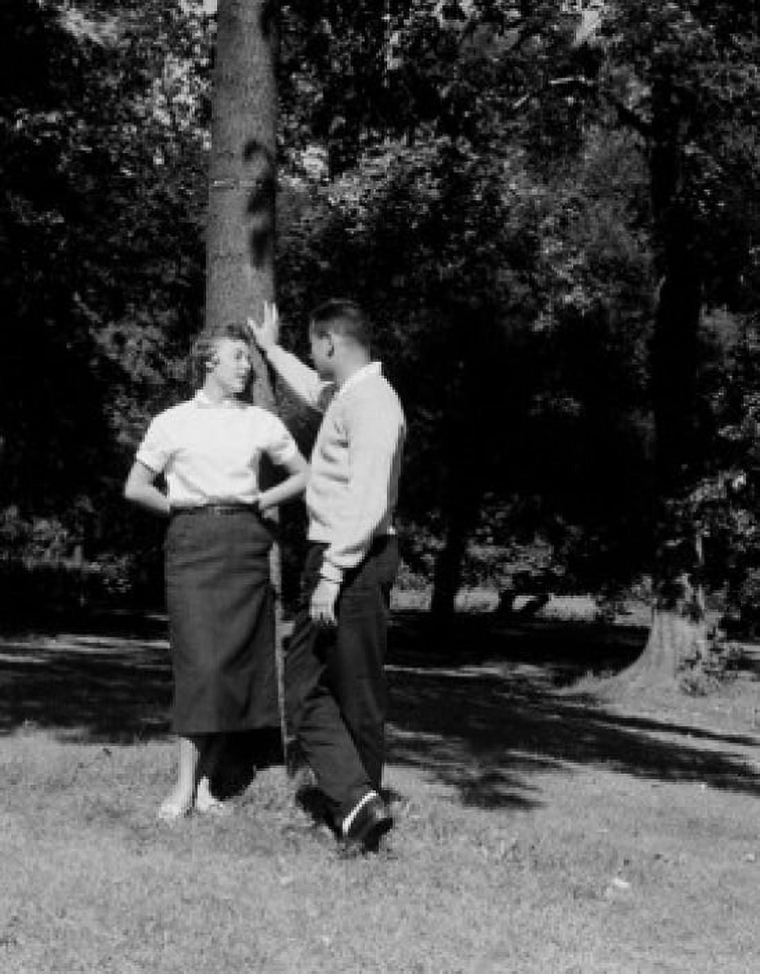 Young couple talking in park Canvas Art - (18 x 24)