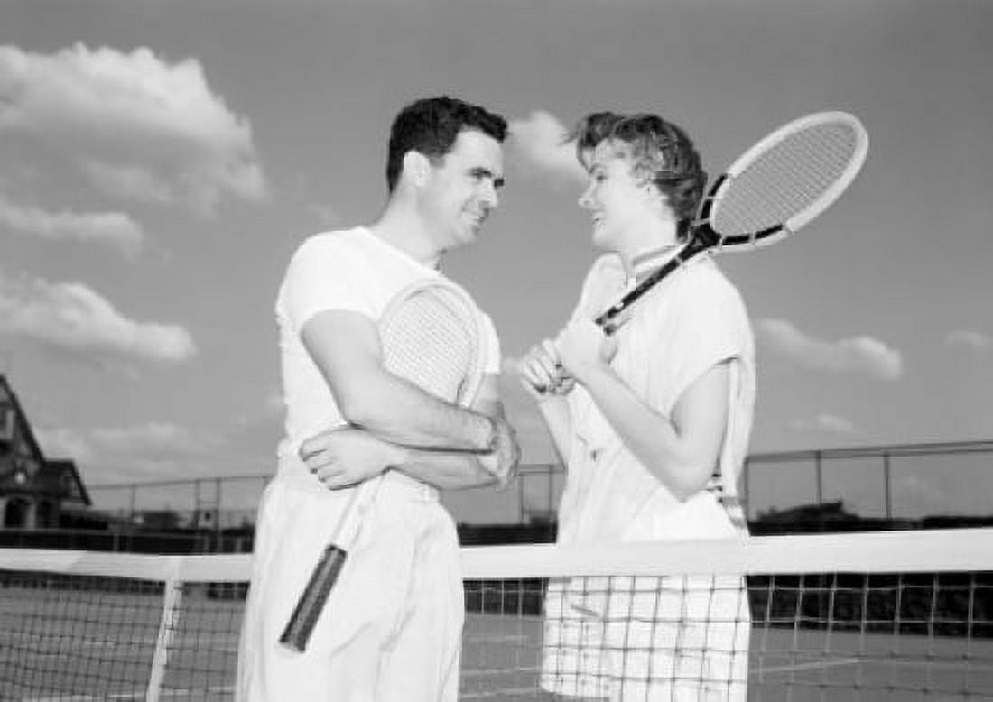 Young couple talking over tennis net Canvas Art -  (24 x 36)