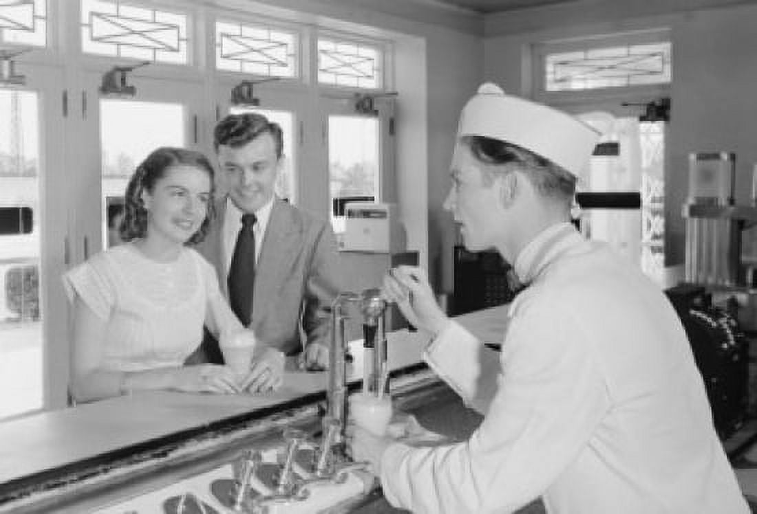 Young couple talking with barman at bar counter Canvas Art - (18 x 24)