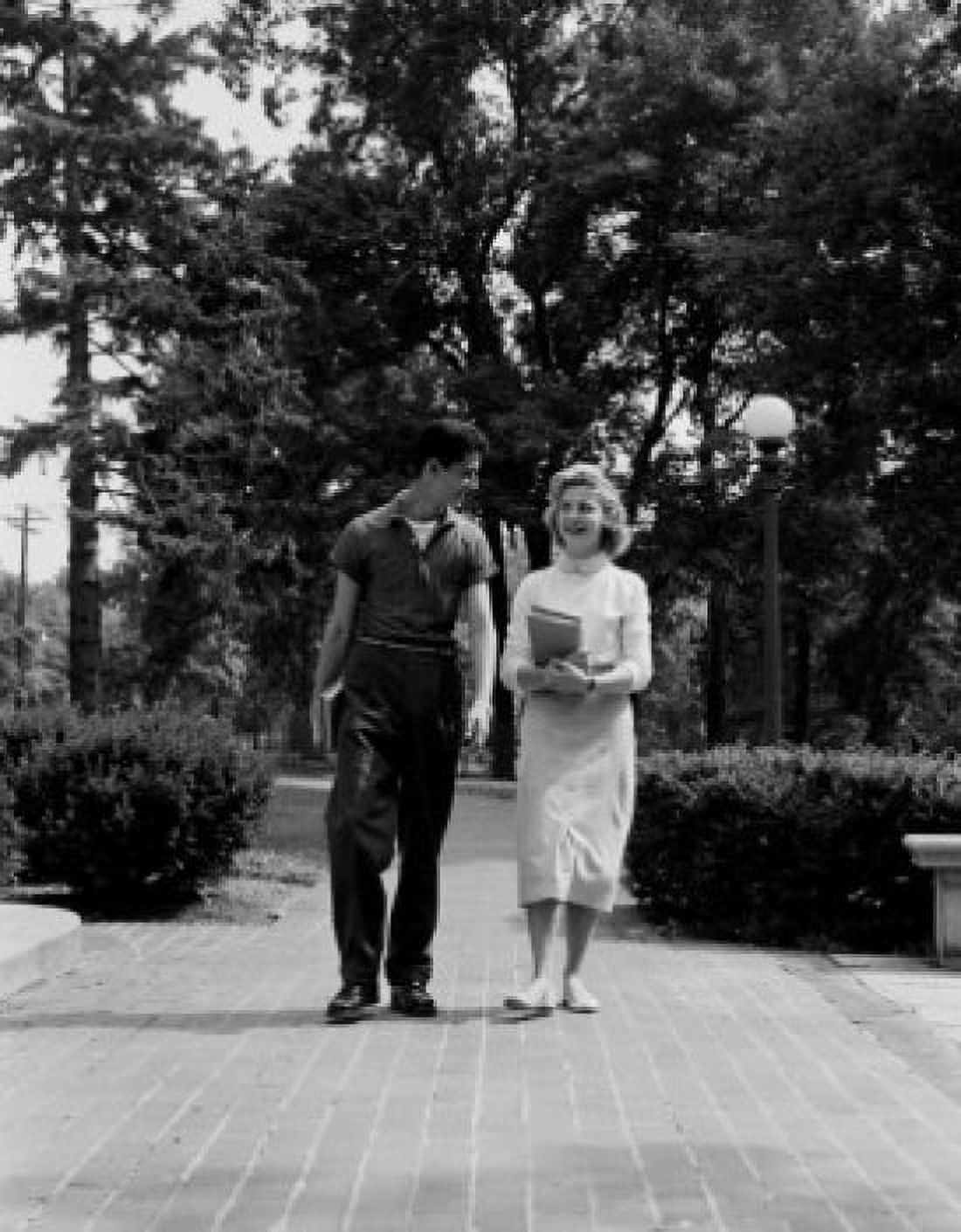 Young couple walking and talking Canvas Art -  (18 x 24)