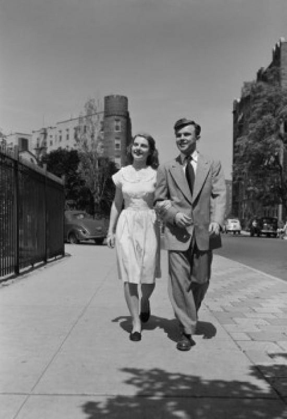 Young couple walking arm in arm in street Canvas Art - (18 x 24)