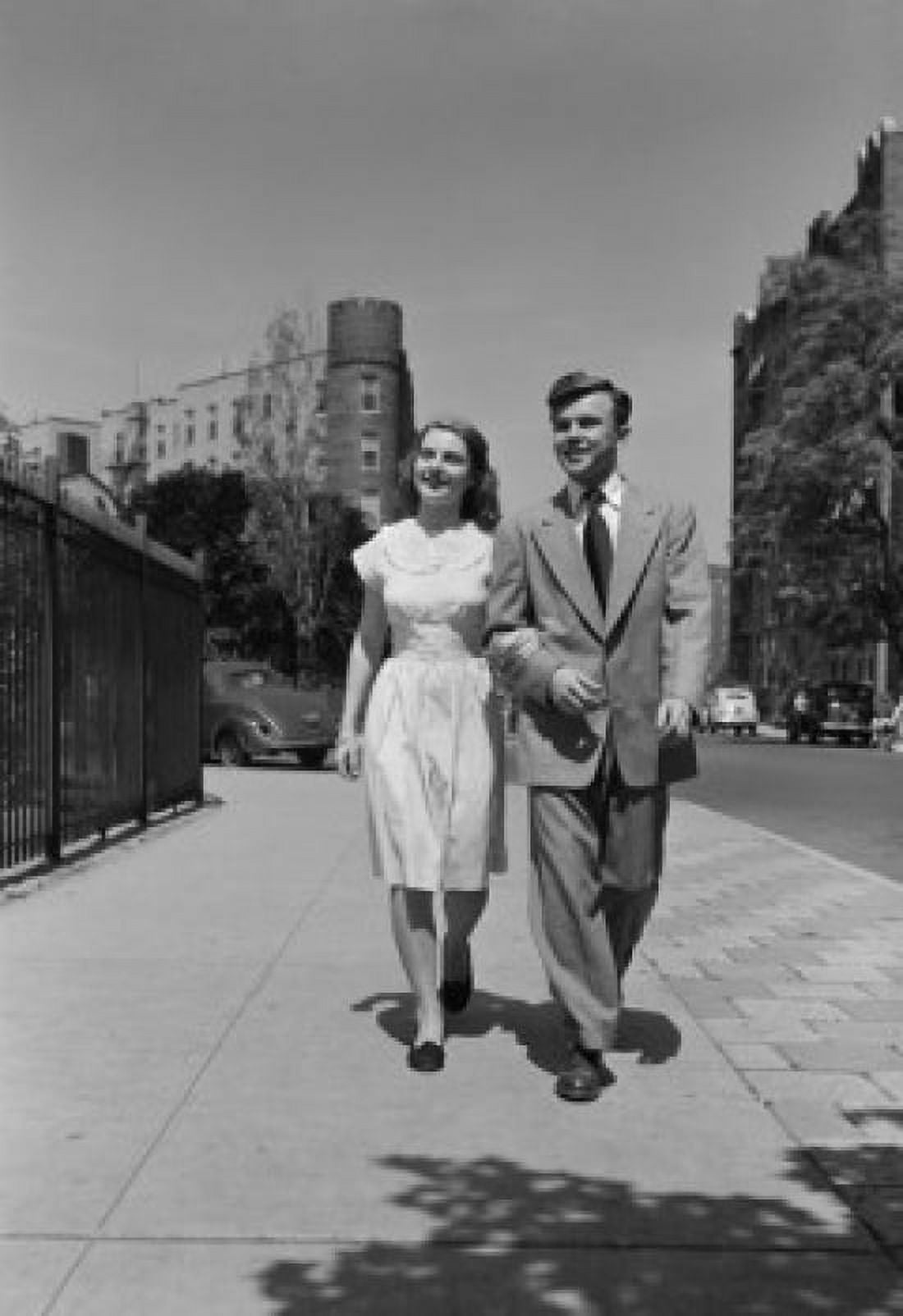 Young couple walking arm in arm in street Canvas Art - (24 x 36)