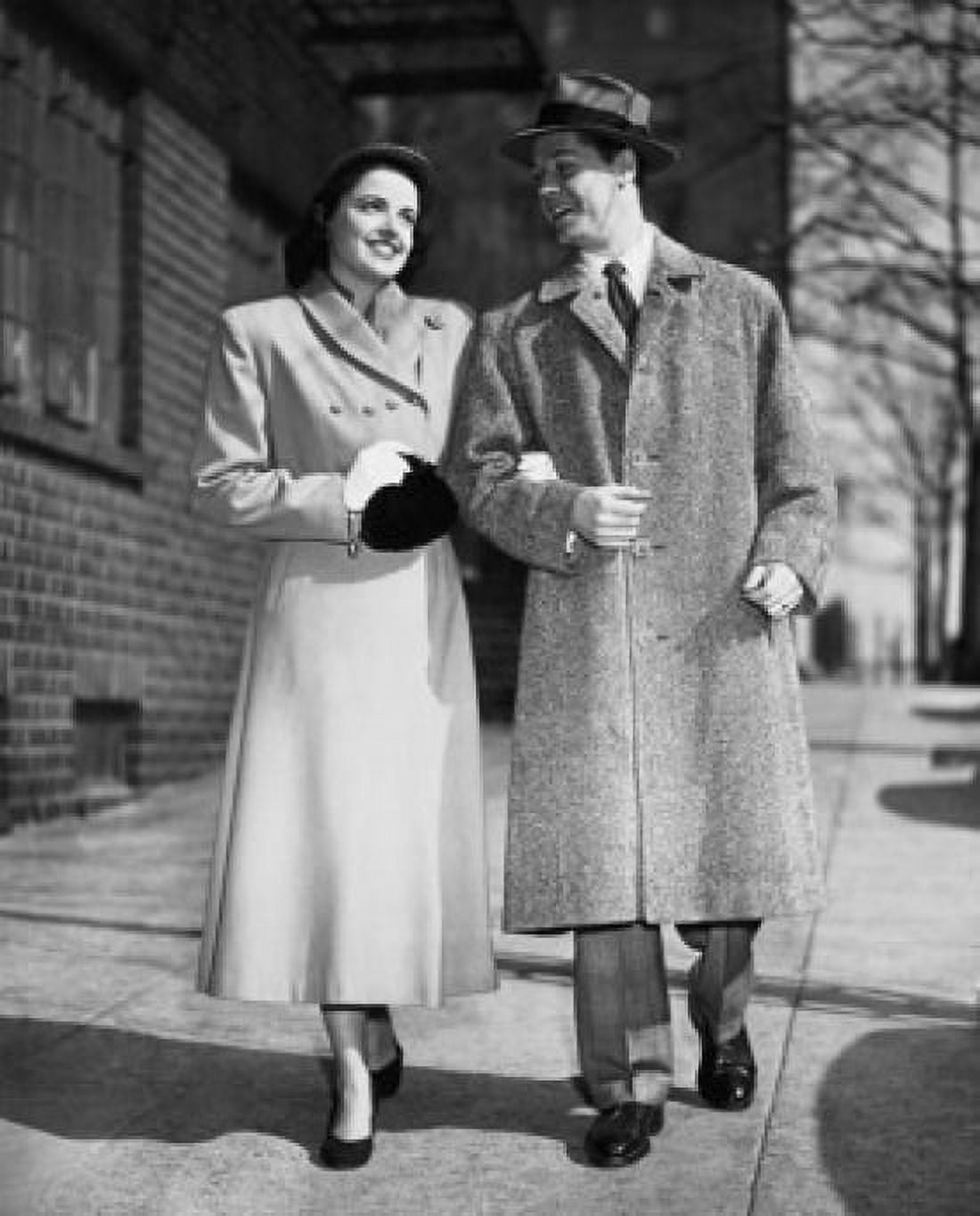 Young couple walking on a sidewalk Canvas Art - (24 x 36)