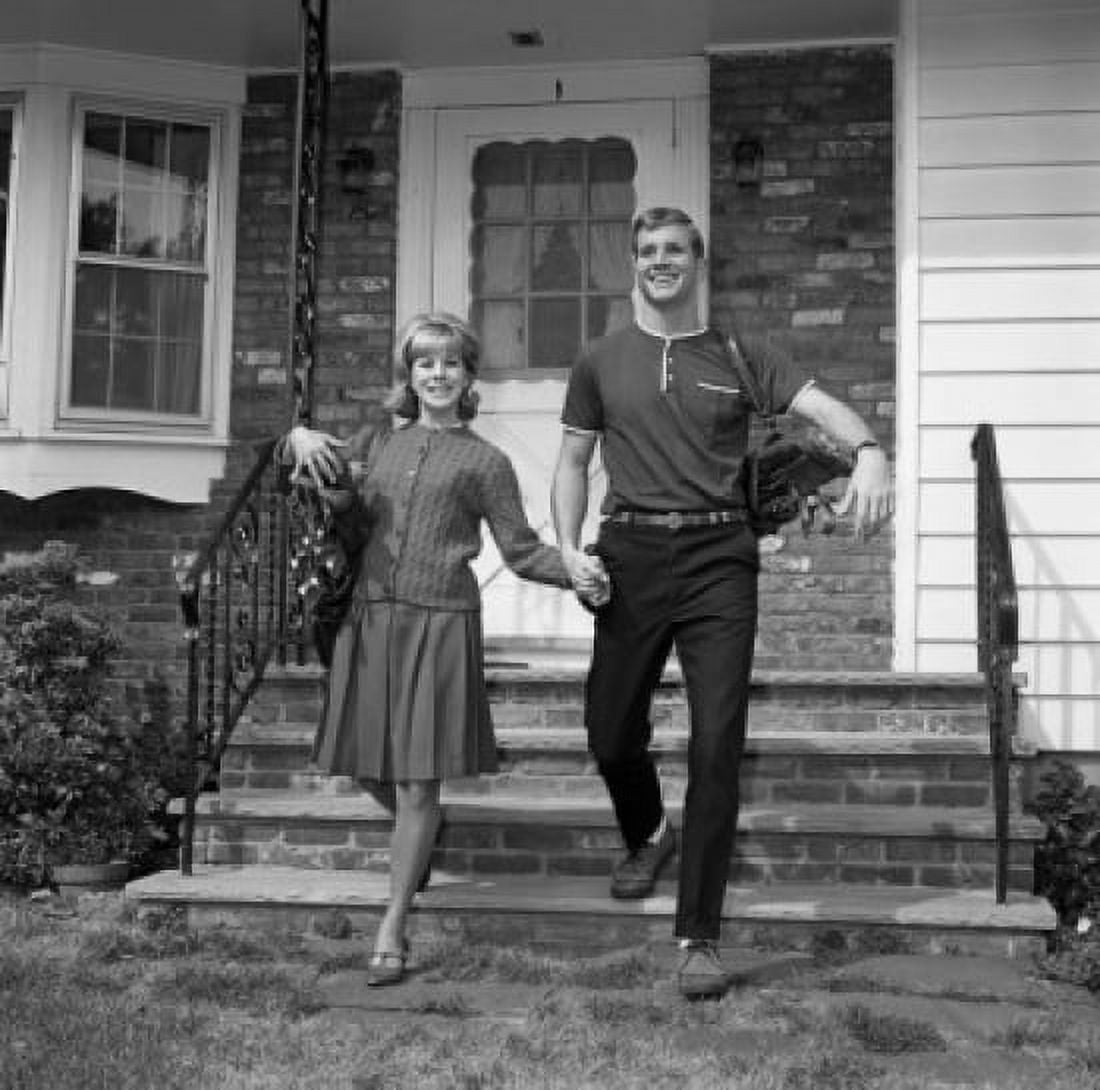 Young couple walking out of home Canvas Art - (24 x 36)