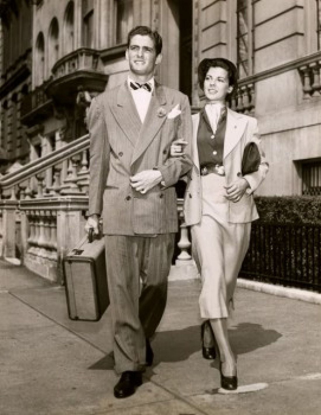 Young couple walking together on the sidewalk Canvas Art -  (18 x 24)
