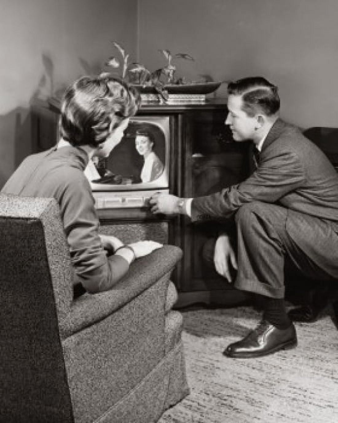 Young couple watching television Canvas Art - (18 x 24)