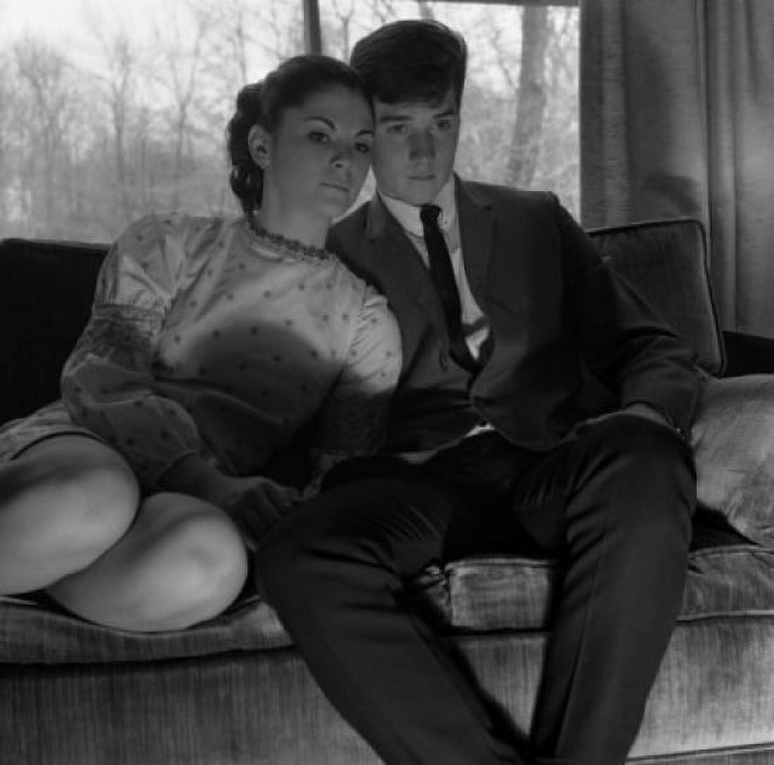 Young couple watching tv on sofa Canvas Art - (24 x 36)