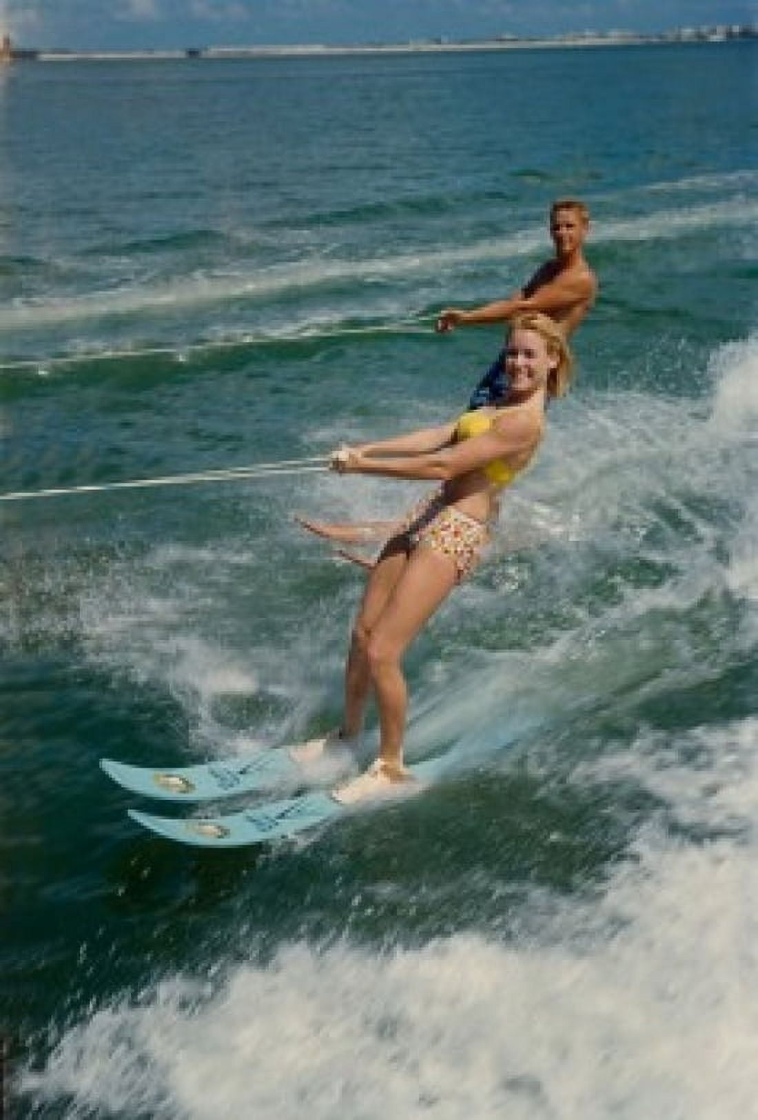 Young couple waterskiing in the sea Canvas Art - (24 x 36)