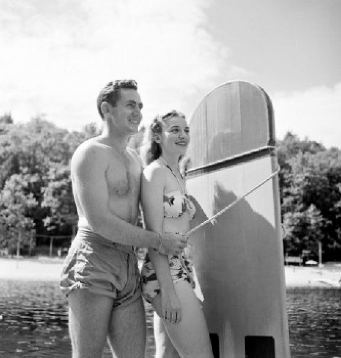 Young couple wearing swimsuits smiling Canvas Art - (18 x 24)