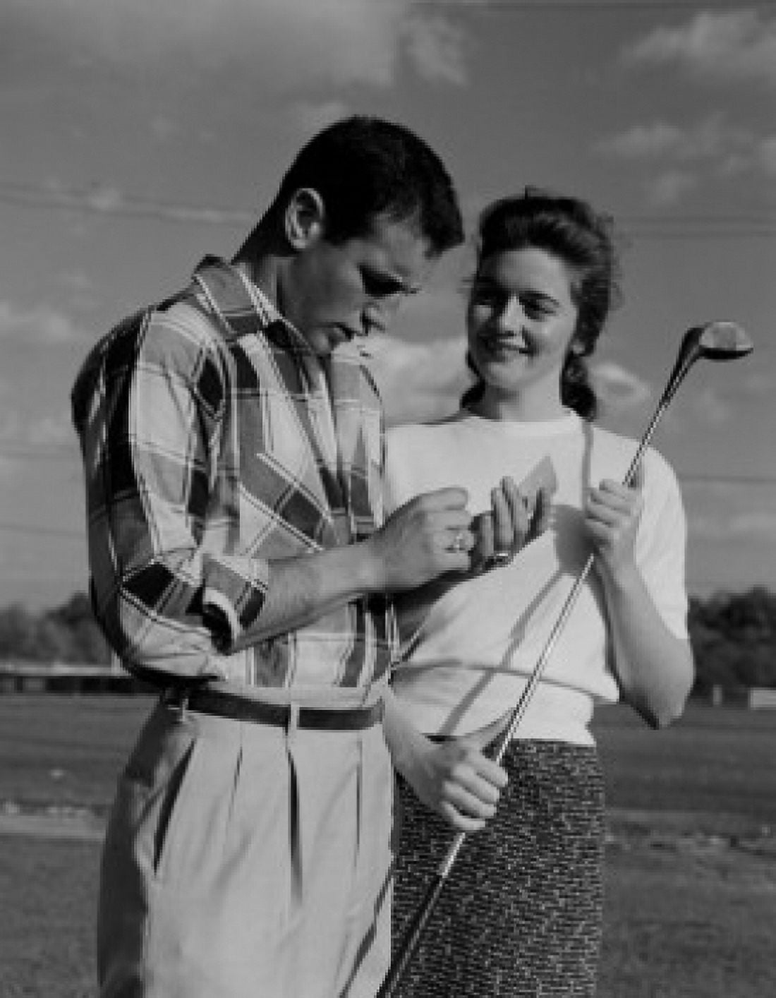 Young couple woman holding golf club Canvas Art - (24 x 36)