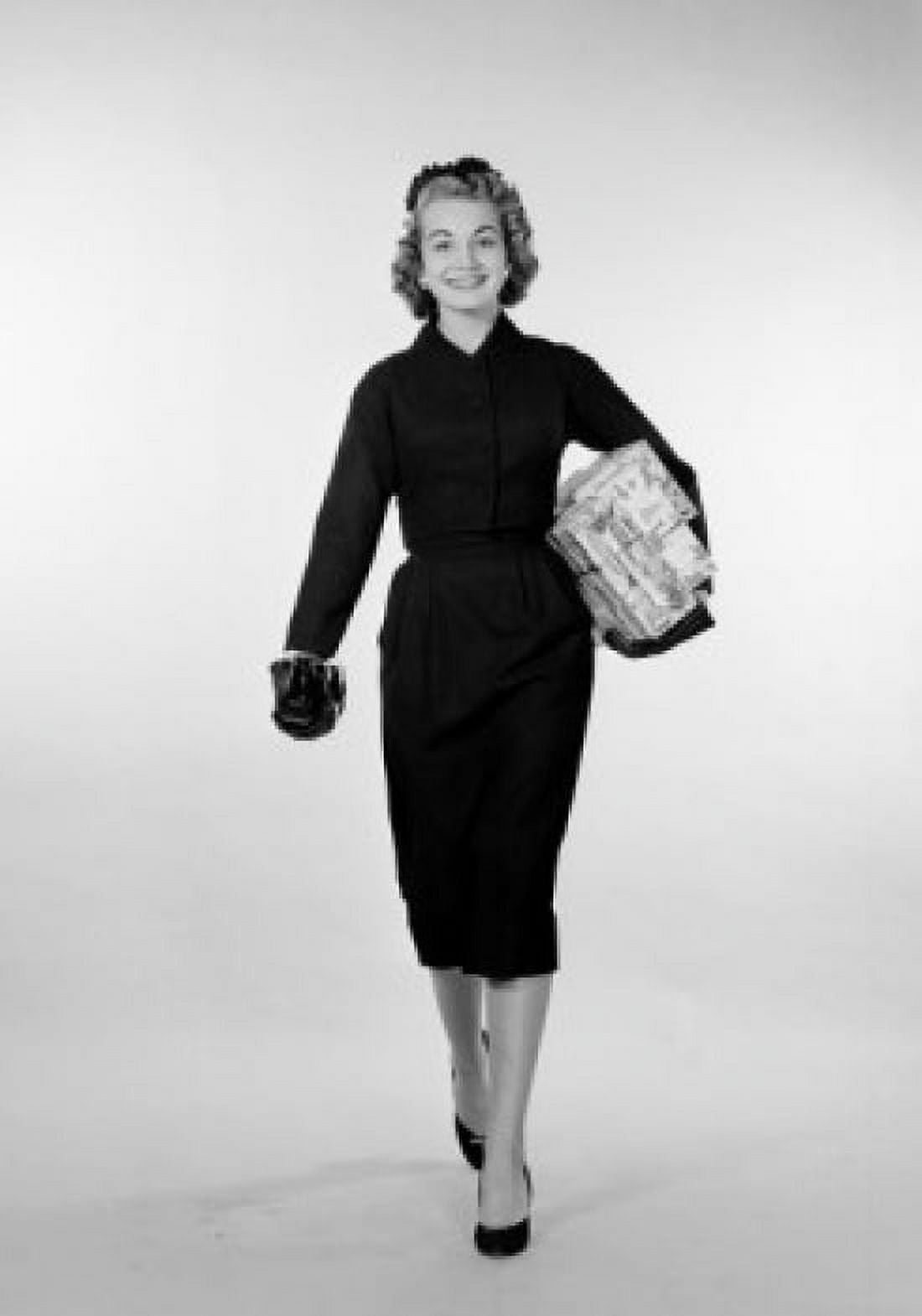 Young elegant woman carrying box Canvas Art - (18 x 24)