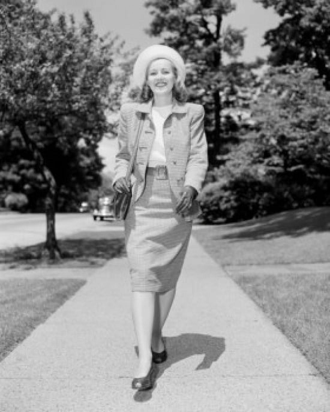 Young elegant woman walking down street Canvas Art - (18 x 24)