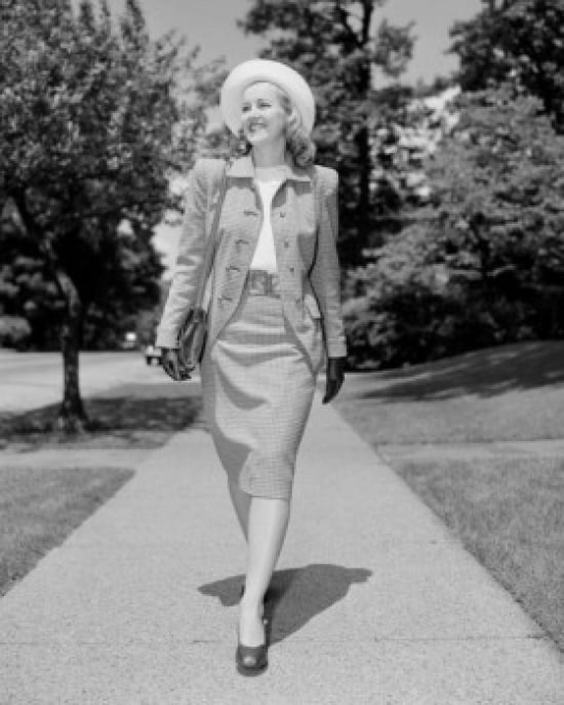 Young elegant woman walking down street Canvas Art - (24 x 36)