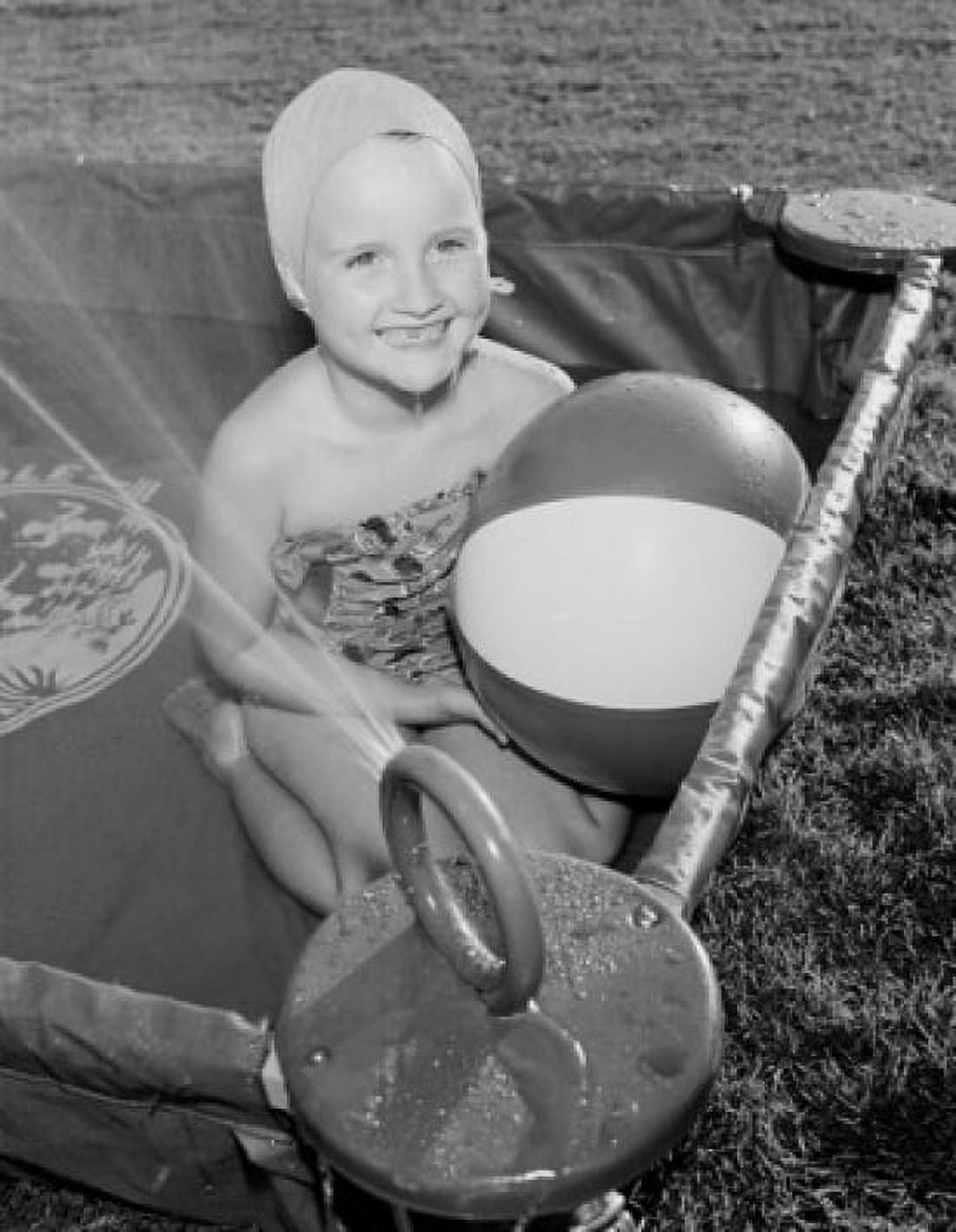 Young girl in outdoor kiddie pool Canvas Art - (24 x 36)