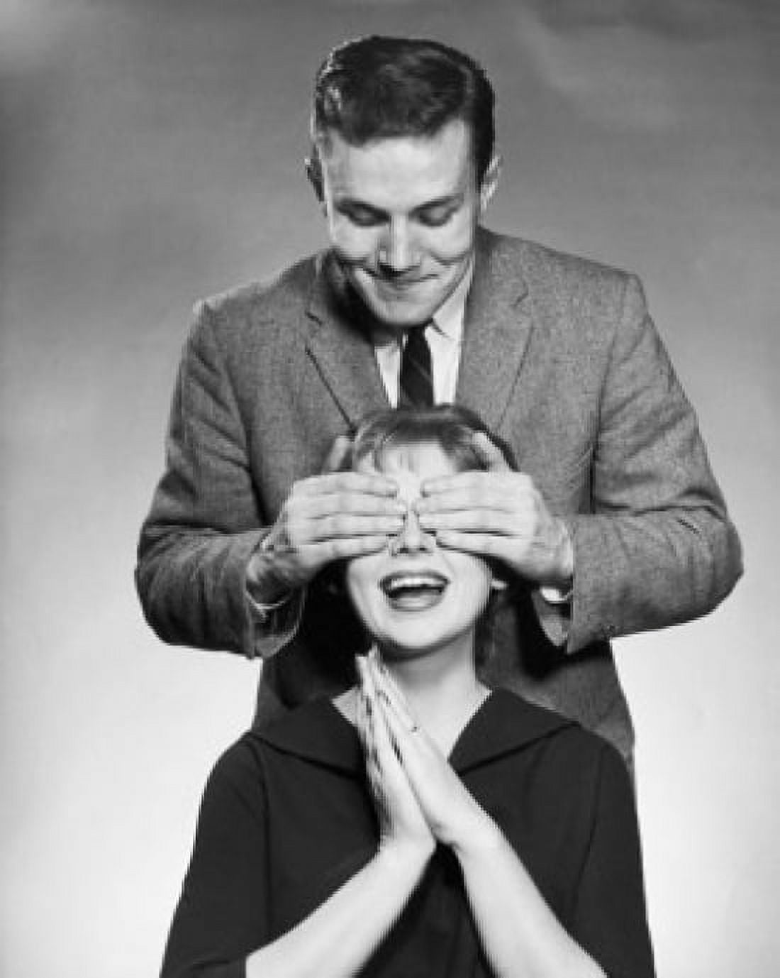 Young man covering the eyes of a young woman from behind Canvas Art - (18 x 24)