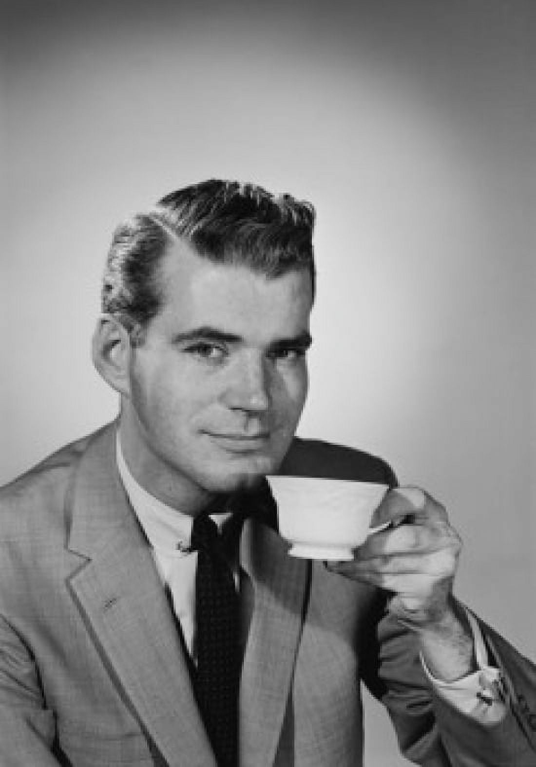Young man drinking tea Canvas Art - (18 x 24)