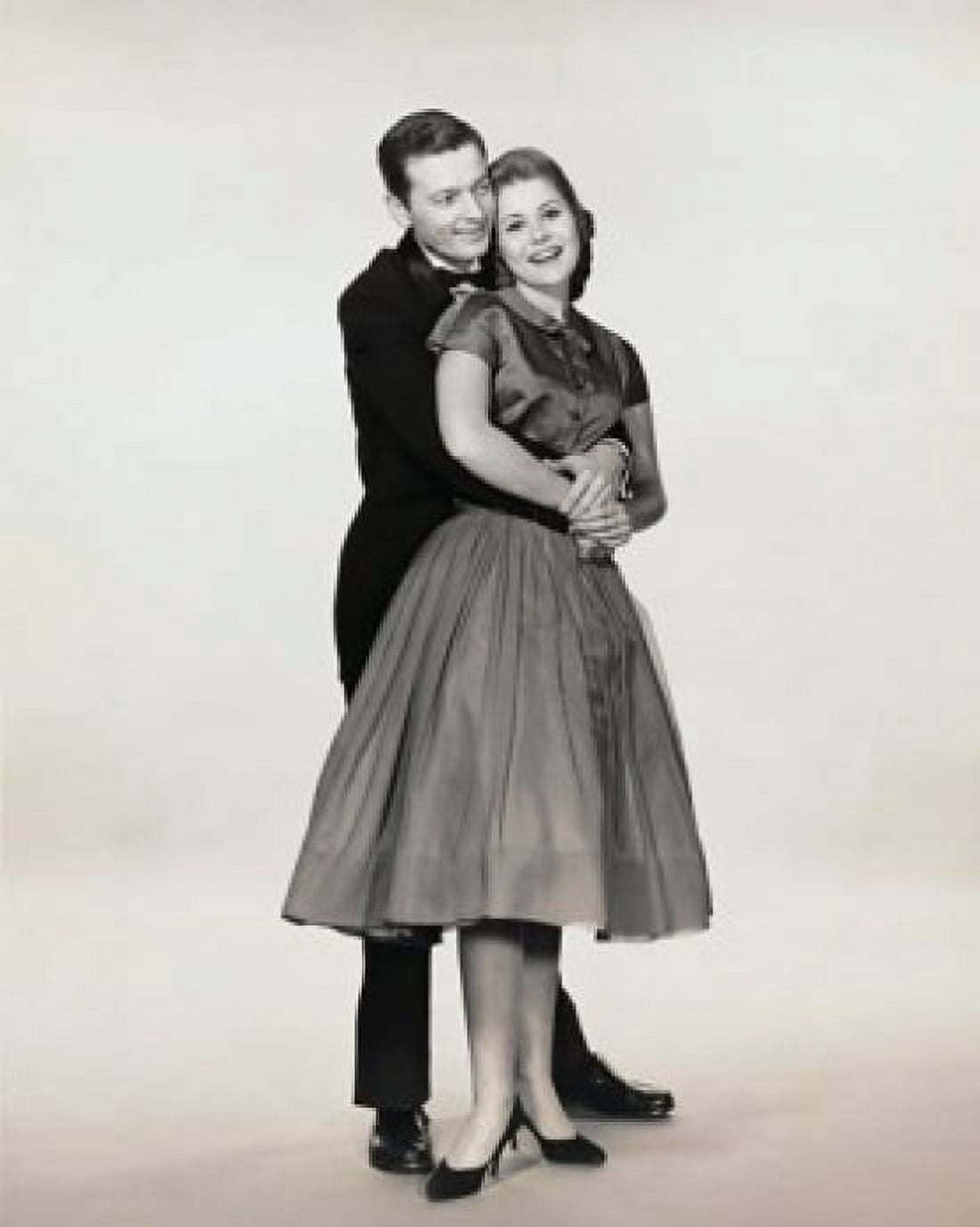 Young man embracing a young woman from behind Canvas Art - (18 x 24)
