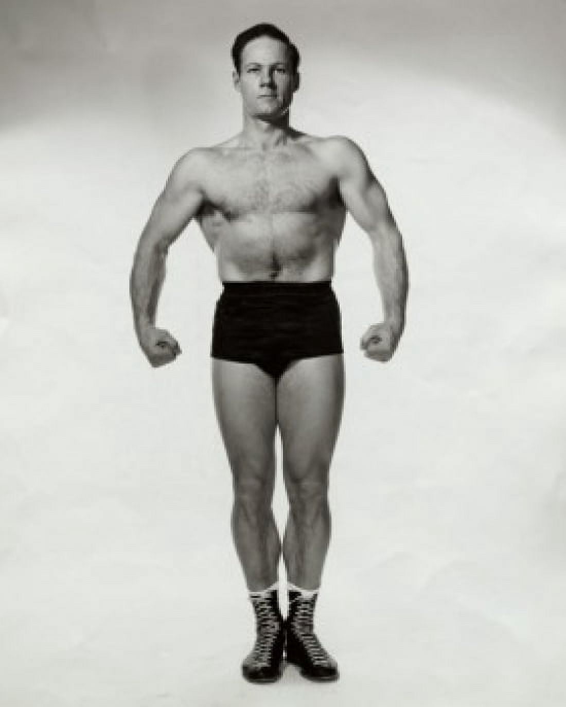 Young man flexing his muscles Canvas Art - (18 x 24)