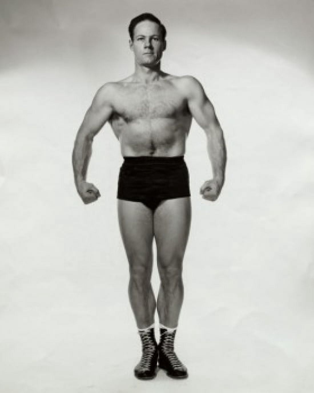 Young man flexing his muscles Canvas Art - (24 x 36)