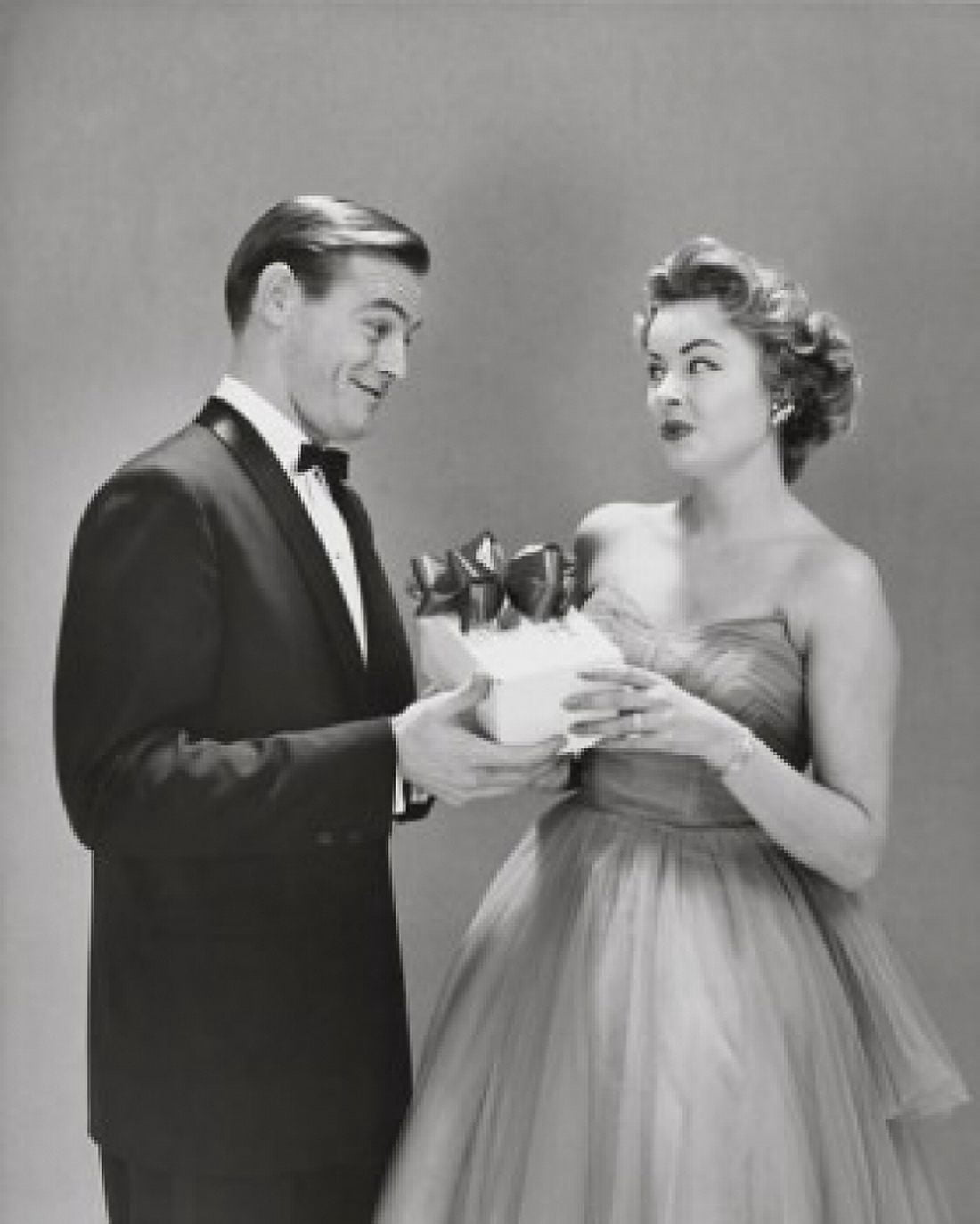 Young man giving a gift to a young woman Canvas Art - (18 x 24)