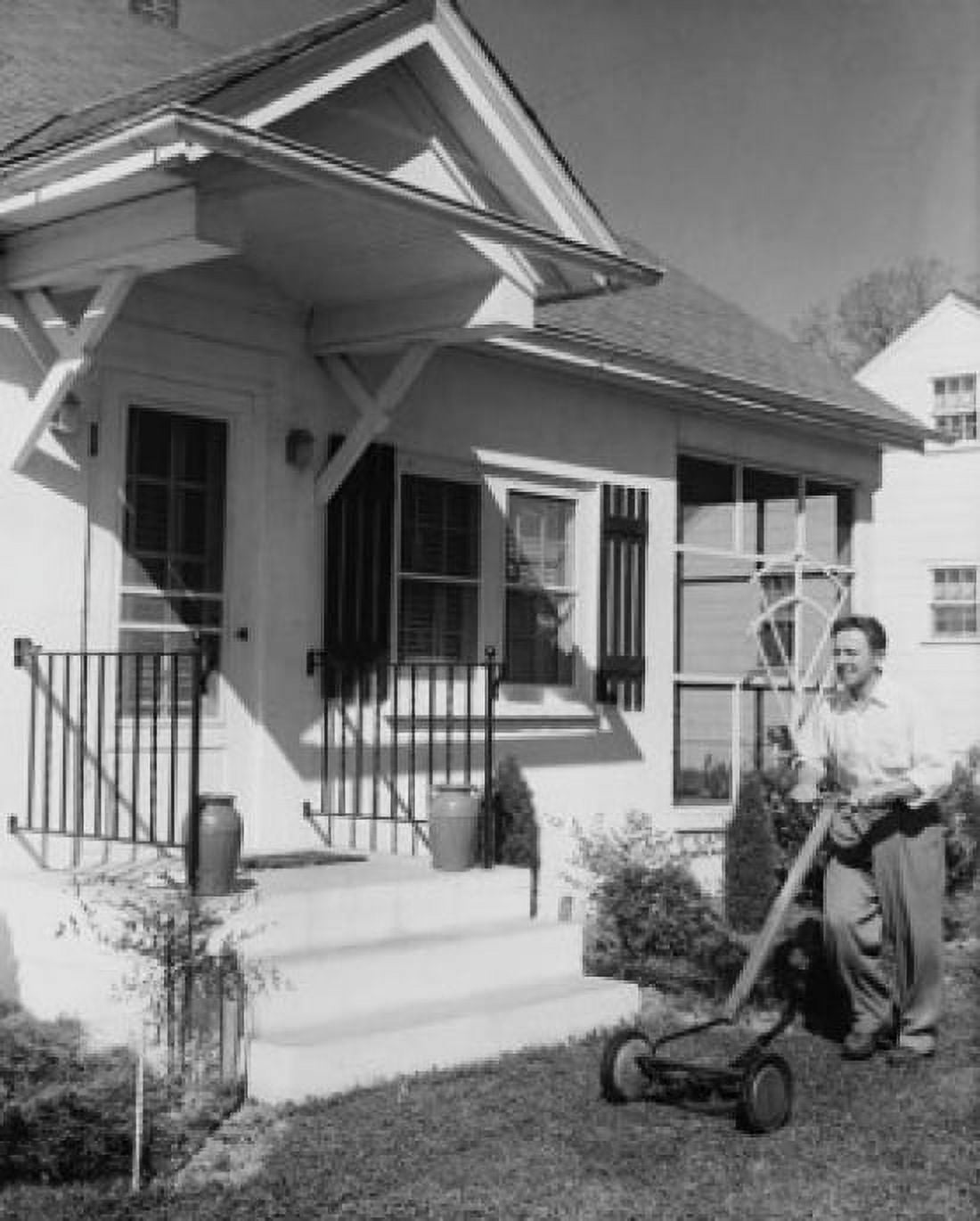 Young man mowing a front lawn Canvas Art - (18 x 24)